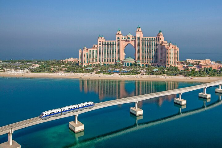 Experience sweeping views of Palm Jumeirah and the iconic Atlantis Hotel. Enjoy a seamless transfer and one-way monorail ride surrounded by stunning coastal beauty. Perfect for unforgettable memories.